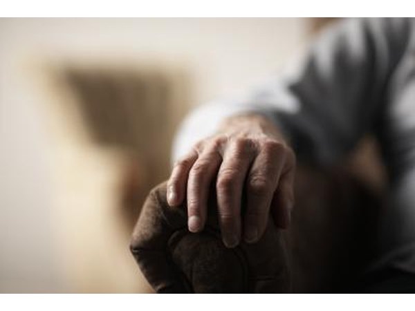 Man with hand on chair