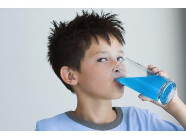 child drinking blue juice