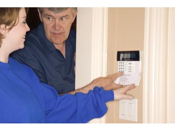 Technician and woman at thermostat