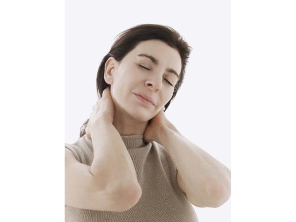 woman rubbing her neck