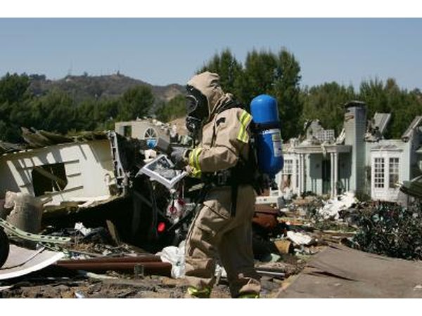 A man evaluates the levels of hazardous materials in a neighborhood after an earthquake.
