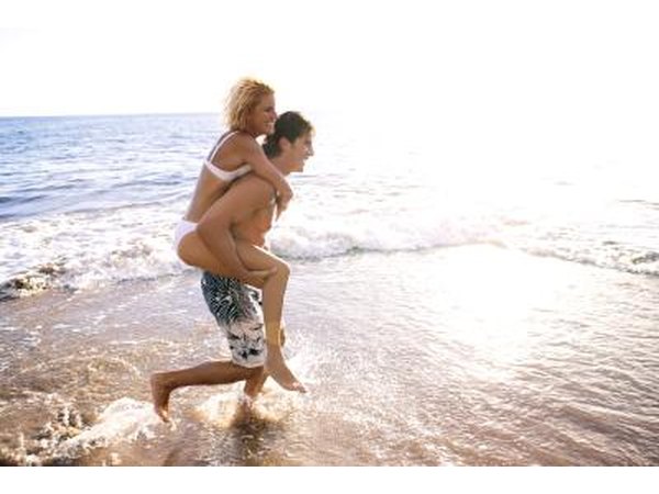 Couple running on beach