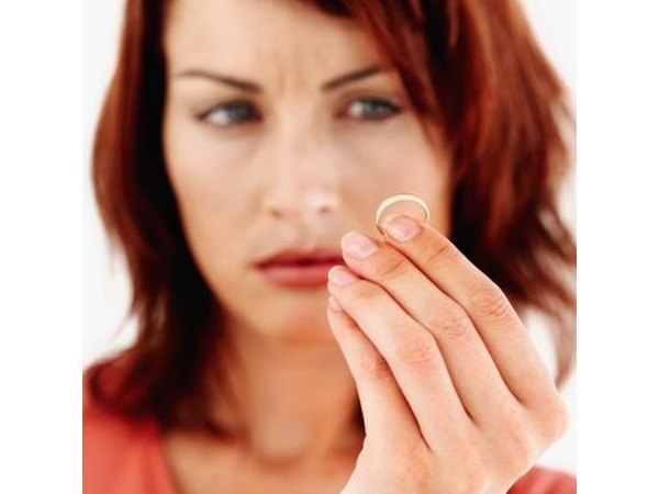 Woman holding wedding ring
