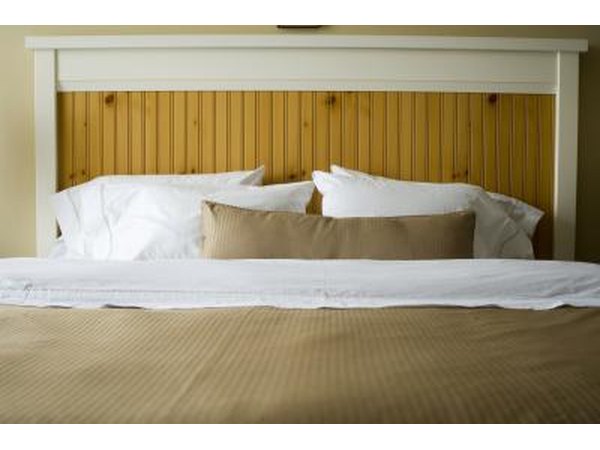 Queen size bed taking up majority of room.
