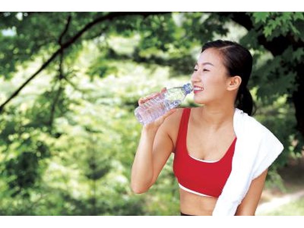 Woman drinking bottle of water