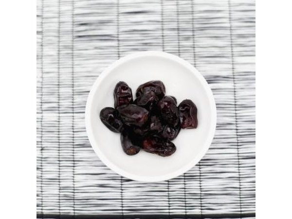 Bowl of dried prunes.