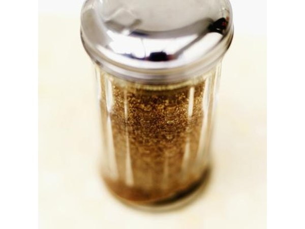 A close-up of a jar of evaporated can juice crystals.