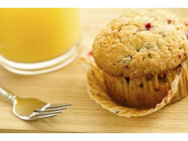 Muscadine muffin beside glass of orange juice
