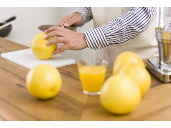 Cutting fruit for juicing.