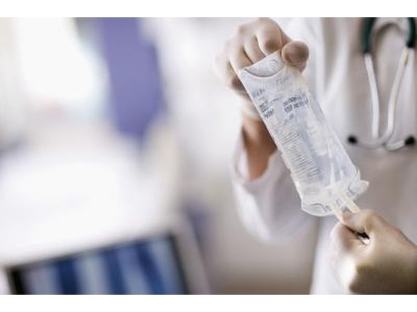 Doctor holding an IV bag