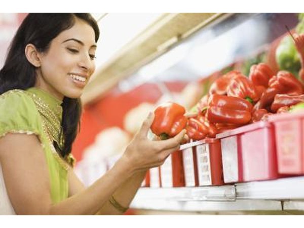 woman holding red pepper