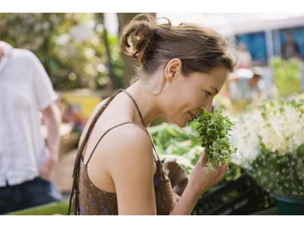 Woman smelling herbs