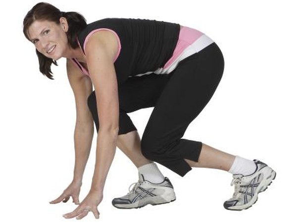 Woman doing squat exercise indoors.