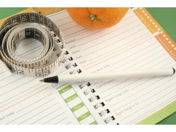 Track your food intake and weight loss in a journal.