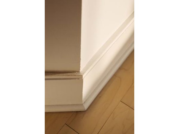 Layer stock molding to creative elaborate baseboards.