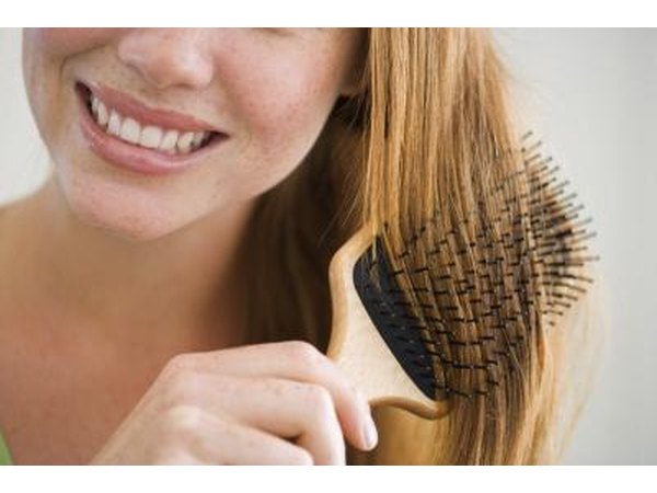 woman brushing her hair
