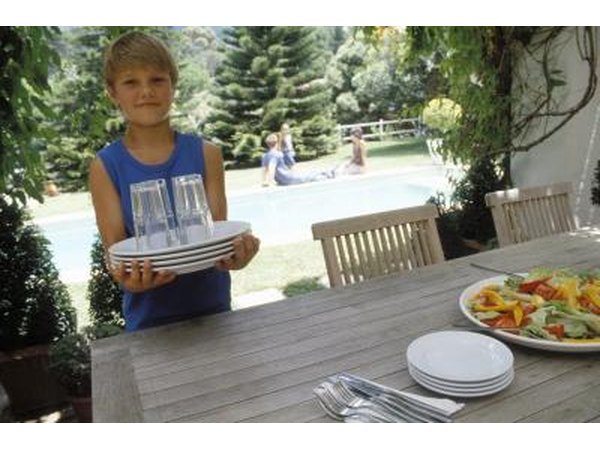 Boy setting table