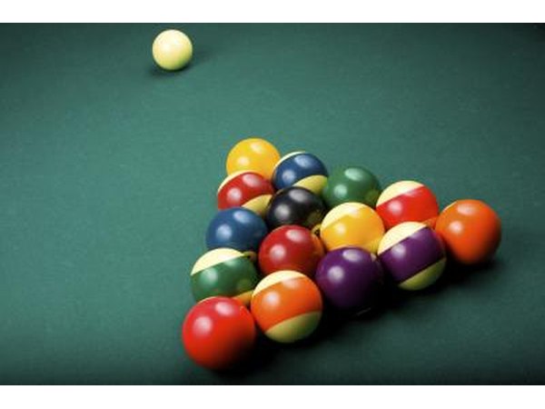 Racked billiards balls and cue ball