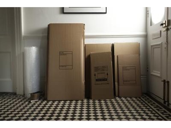 Tall boxes stand against the kitchen wall