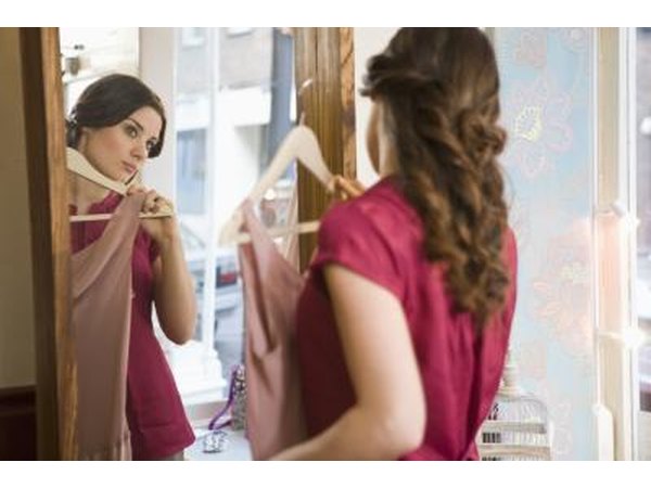 Woman looking in mirror