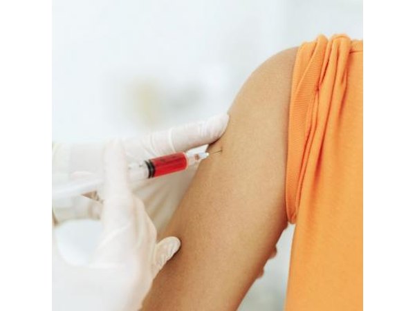A woman gets her blood drawn.