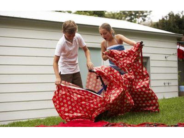 Children unwrapping two bicycles