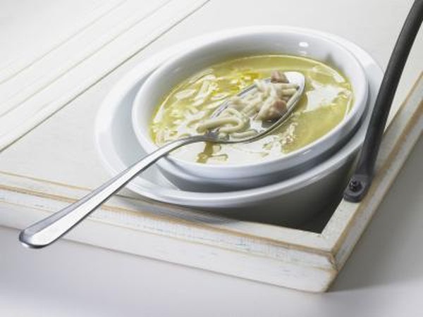 A bowl of simple chicken noodle soup.