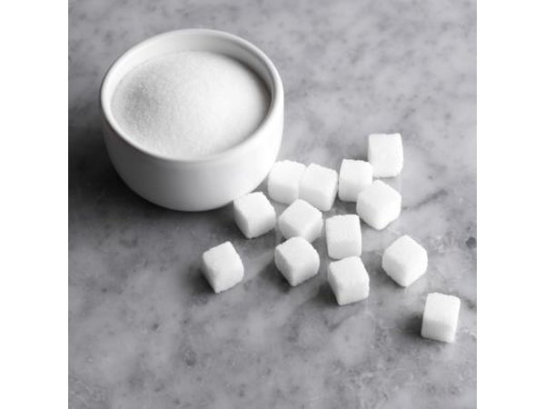 Bowl of sugar and sugarcubes.
