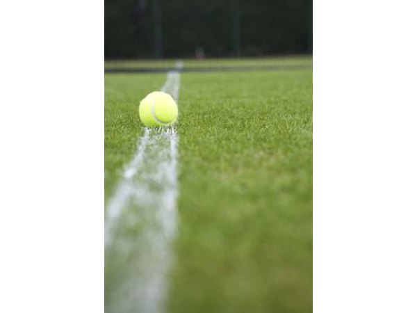 Installing the synthetic turf is one of the last steps before enjoying a game.
