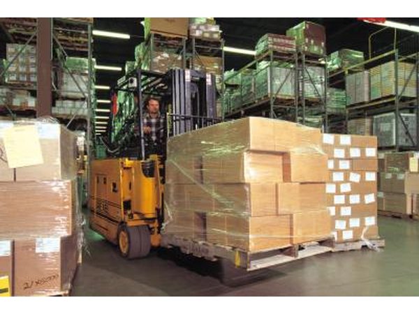 warehouse worker driving forklift