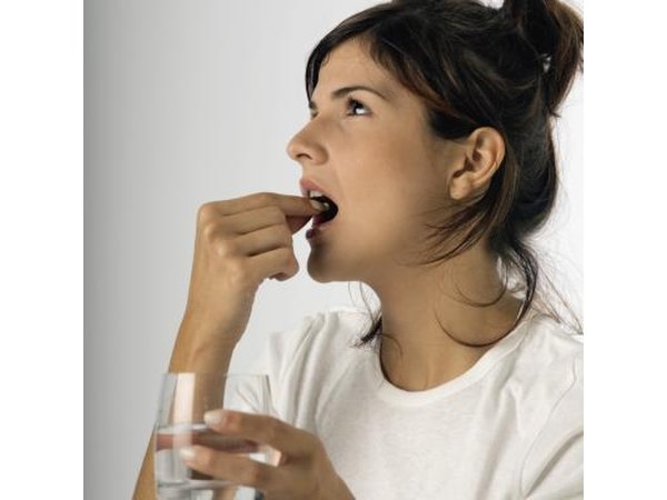 Woman taking pill
