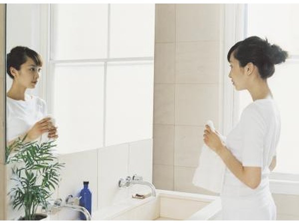 Woman looking in mirror