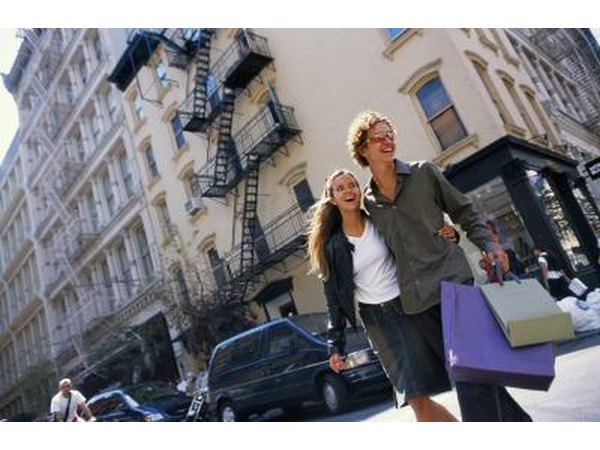 A young couple shops together in the city.