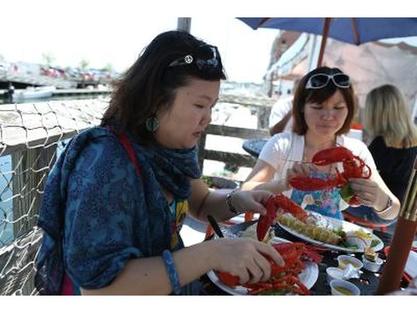 Tourists enjoy cooked lobster in Portland, Maine
