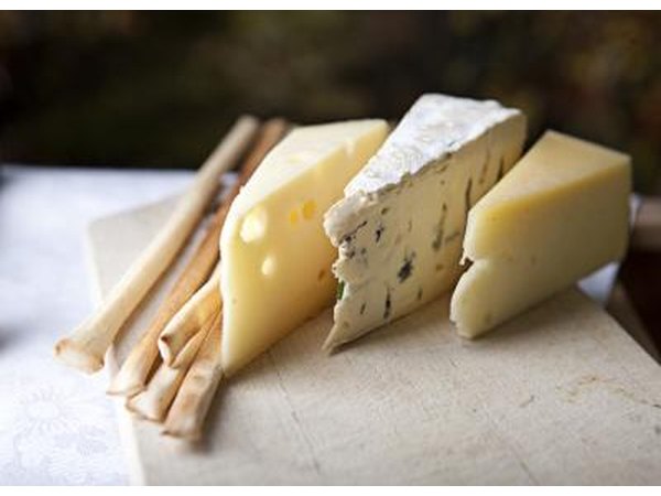 Cutting board with different types of cheese