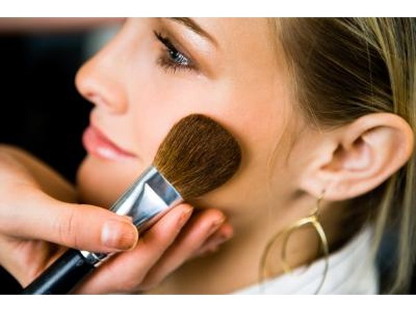 Woman having makeup done