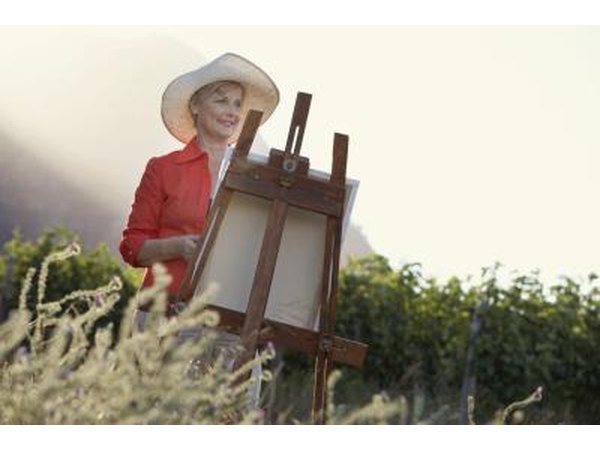 Woman painting in field