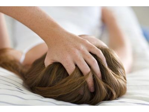 Woman holding head