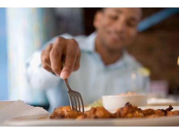 Man eating chicken