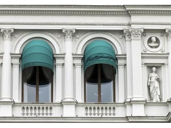 Awnings over two windows and a balcony.