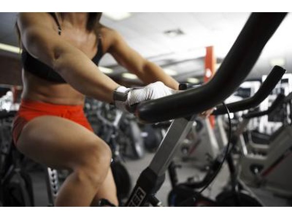 Stationary biking provides a workout for your legs.