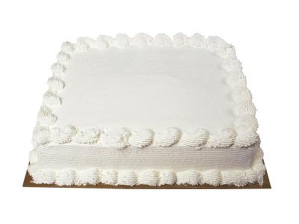 Dress the cake up with baby cake toppers.