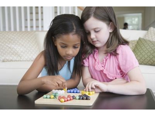 Girls playing board game