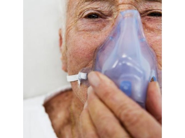 Older man with a plastic breathing mask