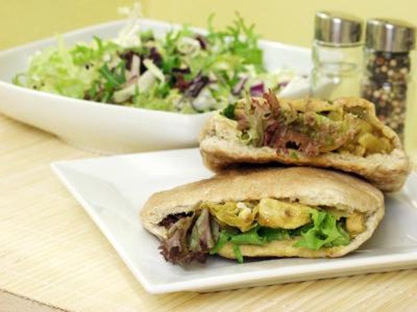 Pita bread sandwich and salad.