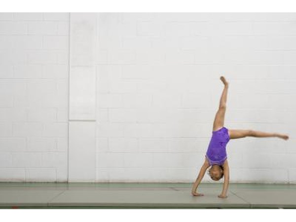 young girl doing cartwheel