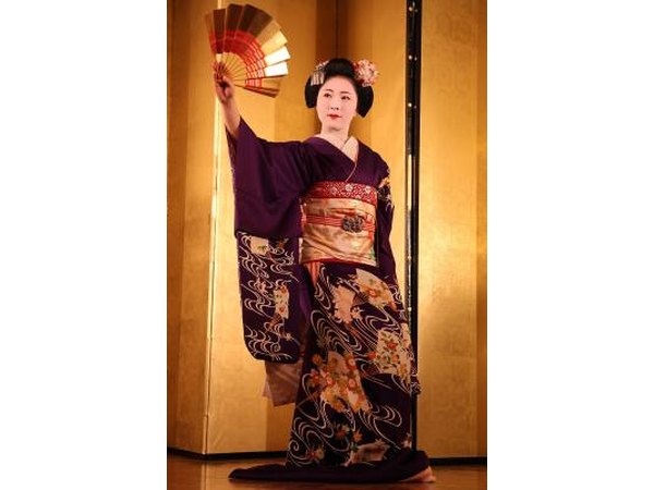Geishas undergo training in Japanese traditional arts.