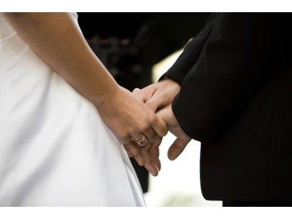 Bride and groom holding hands