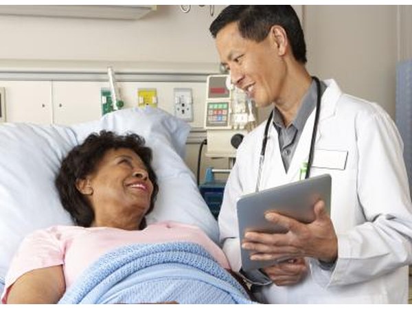 Woman talking with doctor after surgery