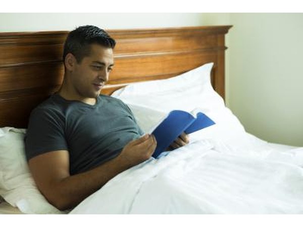A man reading in bed